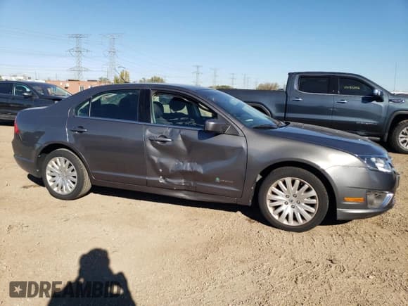 ✅ 2012 Ford Fusion Hybrid • VIN: 3FADP0L39CR391243 • Lot: 81672055. Listed on Copart with 126,512 mi. Free auction sales archive from the USA and detailed vehicle history report at DreamBid. Image 4.