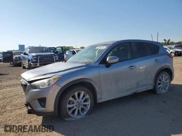 ✅ 2014 Mazda CX-5 Grand Touring • VIN: JM3KE4DY1E0426327 • Лот: 70492415. Опубликован ранее на Copart с пробегом 177 180 миль. Бесплатный доступ к архиву аукционных продаж из США и подробный отчёт об истории автомобиля на DreamBid. Изображение 1.
