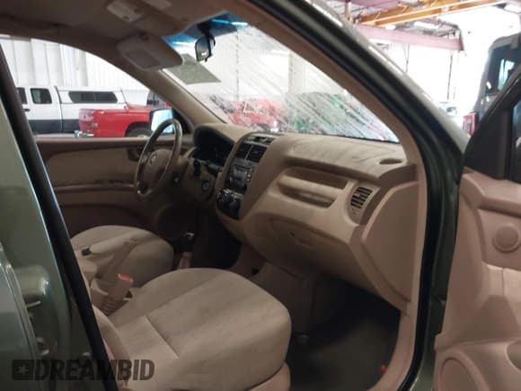 ✅ 2006 Kia Sportage LX • VIN: KNDJE724967292584 • Lot: 40690832. Listed on IAAI with 243,128 mi. Free auction sales archive from the USA and detailed vehicle history report at DreamBid. Image 5.