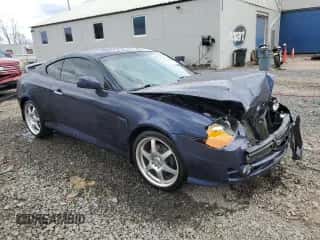 2004 Hyundai Tiburon GT с VIN KMHHN65F14U109145, выставлен на аукционе Copart как лот 51117385 с пробегом Не указан миль и Списание • Salvage title. История ставок и продаж доступна на DreamBid. Изображение 4.