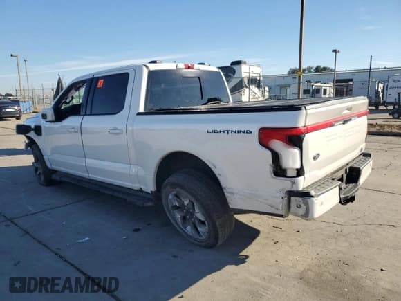 ✅ 2023 Ford F-150 Lightning Lariat • VIN: 1FTVW1EV0PWG12849 • Lot: 87083755. Listed on Copart with 35,557 mi. Free auction sales archive from the USA and detailed vehicle history report at DreamBid. Image 2.