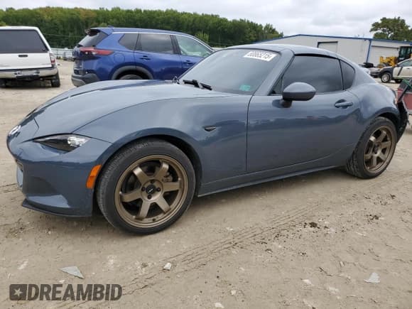 ✅ 2021 Mazda MX-5 Miata Grand Touring • VIN: JM1NDAM73M0452571 • Lot: 80865215. Listed on Copart with 54,448 mi. Free auction sales archive from the USA and detailed vehicle history report at DreamBid. Image 1.