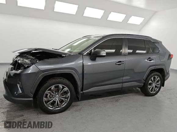 ✅ 2023 Toyota RAV4 Hybrid XLE Premium • VIN: JTMB6RFV9PD085163 • Лот: 84563665. Опубликован ранее на Copart с пробегом 115 711 миль. Бесплатный доступ к архиву аукционных продаж из США и подробный отчёт об истории автомобиля на DreamBid. Изображение 1.