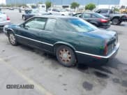 ✅ 1998 Cadillac Eldorado Touring • VIN: 1G6ET1299WU613236 • Lot: 43173727. Listed on IAAI with 165,556 mi. Free auction sales archive from the USA and detailed vehicle history report at DreamBid. Image 3.