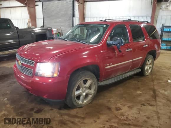 2013 Chevrolet Tahoe LTZ z VIN 1GNSKCE07DR373610, wystawiony jako Copart lot #67510235 z przebiegiem 157 323 mil mil oraz Czysty tytuł • Clean title. Historia ofert i sprzedaży dostępna na DreamBid. Obrazek 1.