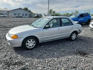 ✅ 2000 Mazda Protege DX • VIN: JM1BJ2226Y0241394 • Lot: 84044025. Wystawiony na Copart z przebiegiem 84 172 mil. Bezpłatny archiwum sprzedaży aukcyjnych z USA i szczegółowy raport historii pojazdu na DreamBid. Zdjęcie 1.