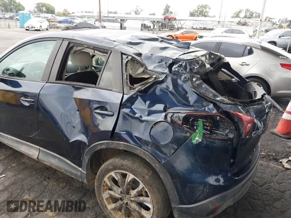 ✅ 2016 Mazda CX-5 Grand Touring • VIN: JM3KE2DY8G0885958 • Lot: 43369411. Wystawiony na IAAI z przebiegiem 171 093 mil. Bezpłatny archiwum sprzedaży aukcyjnych z USA i szczegółowy raport historii pojazdu na DreamBid. Zdjęcie 6.