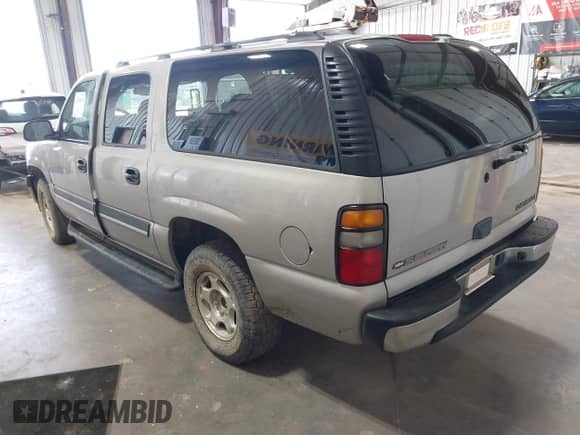 2005 Chevrolet Suburban LS z VIN 1GNFK16Z85J145229, wystawiony jako IAAI lot #42706478 z przebiegiem 198 500 mil mil oraz . Historia ofert i sprzedaży dostępna na DreamBid. Obrazek 3.