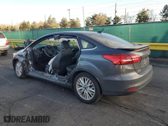 ✅ 2018 Ford Focus Titanium • VIN: 1FADP3J20JL216872 • Lot: 93197025. Wystawiony na Copart z przebiegiem 30 726 mil. Bezpłatny archiwum sprzedaży aukcyjnych z USA i szczegółowy raport historii pojazdu na DreamBid. Zdjęcie 2.