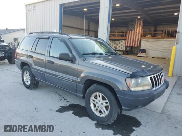 ✅ 2003 Jeep Grand Cherokee Laredo • VIN: 1J4GX48S73C522371 • Lot: 91577645. Listed on Copart with 276,316 mi. Free auction sales archive from the USA and detailed vehicle history report at DreamBid. Image 4.