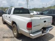 ✅ 2003 Dodge Dakota SLT • VIN: 1D7HL48X63S144573 • Lot: 42798150. Wystawiony na IAAI z przebiegiem 224 361 mil. Bezpłatny archiwum sprzedaży aukcyjnych z USA i szczegółowy raport historii pojazdu na DreamBid. Zdjęcie 3.