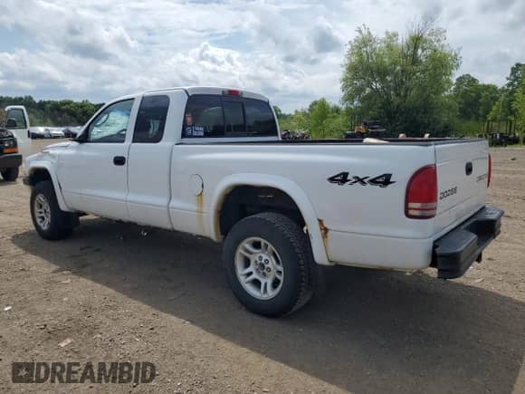 2003 Dodge Dakota Sport z VIN 1D7HG32NX3S345172, wystawiony jako Copart lot #65775335 z przebiegiem 169 253 mil mil oraz Szkoda całkowita • Salvage title. Historia ofert i sprzedaży dostępna na DreamBid. Obrazek 2.