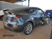 ✅ 2024 Tesla Model Y Long Range • VIN: 7SAYGDEE8RA226005 • Lot: 93294135. Listed on Copart with 15,121 mi. Free auction sales archive from the USA and detailed vehicle history report at DreamBid. Image 3.