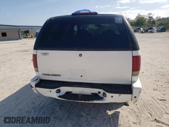 2004 Chevrolet Blazer Fleet z VIN 1GNCS13X64K155966, wystawiony jako Copart lot #53891204 z przebiegiem 132 761 mil mil oraz Szkoda całkowita • Salvage title. Historia ofert i sprzedaży dostępna na DreamBid. Obrazek 6.