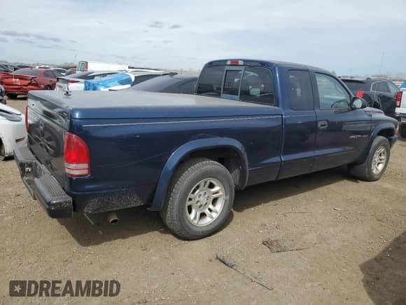 2002 Dodge Dakota Sport z VIN 1B7GL32X12S716897, wystawiony jako Copart lot #54347825 z przebiegiem 85 820 mil mil oraz Czysty tytuł • Clean title. Historia ofert i sprzedaży dostępna na DreamBid. Obrazek 3.