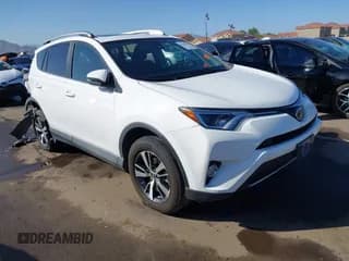 ✅ 2018 Toyota RAV4 XLE • VIN: 2T3WFREV8JW484448 • Lot: 43455380. Listed on IAAI with 112,899 mi. Free auction sales archive from the USA and detailed vehicle history report at DreamBid. Image 1.