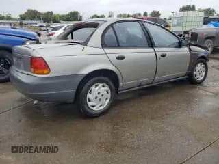 ✅ 1999 Saturn SL • VIN: 1G8ZF5281XZ252460 • Лот: 71125634. Опубликован ранее на Copart с пробегом Не указан. Бесплатный доступ к архиву аукционных продаж из США и подробный отчёт об истории автомобиля на DreamBid. Изображение 3.