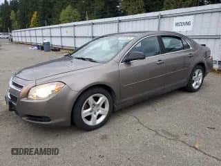 ✅ 2012 Chevrolet Malibu 1LS • VIN: 1G1ZB5E09CF150285 • Lot: 86843625. Listed on Copart with 129,115 mi. Free auction sales archive from the USA and detailed vehicle history report at DreamBid. Image 1.