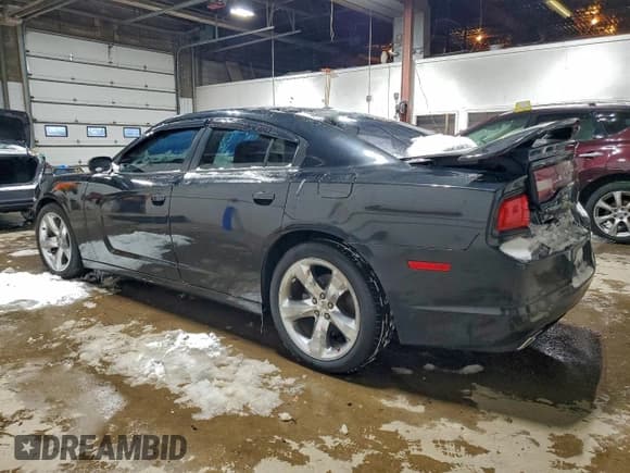 ✅ 2013 Dodge Charger Road/Track • VIN: 2C3CDXCT4DH684749 • Lot: 94906265. Listed on Copart with 128,035 mi. Free auction sales archive from the USA and detailed vehicle history report at DreamBid. Image 2.