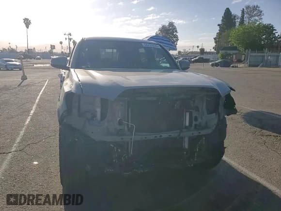 ✅ 2023 Toyota Tacoma SR • VIN: 3TMCZ5AN2PM564332 • Lot: 56237625. Listed on Copart with 82,789 mi. Free auction sales archive from the USA and detailed vehicle history report at DreamBid. Image 14.