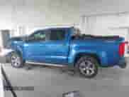 2018 Chevrolet Colorado 4WD Z71 z VIN 1GCGTDENXJ1155801, wystawiony jako IAAI lot #43394572 z przebiegiem 75 912 mil mil oraz . Historia ofert i sprzedaży dostępna na DreamBid. Obrazek 14.