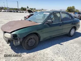 ✅ 2000 Mitsubishi Mirage DE • VIN: JA3AY26C8YU036869 • Lot: 66696405. Listed on Copart with 302,635 mi. Free auction sales archive from the USA and detailed vehicle history report at DreamBid. Image 1.