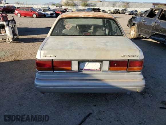 ✅ 1991 Dodge Spirit • VIN: 1B3XA5639MF549470 • Lot: 76051284. Listed on Copart with 62,309 mi. Free auction sales archive from the USA and detailed vehicle history report at DreamBid. Image 6.