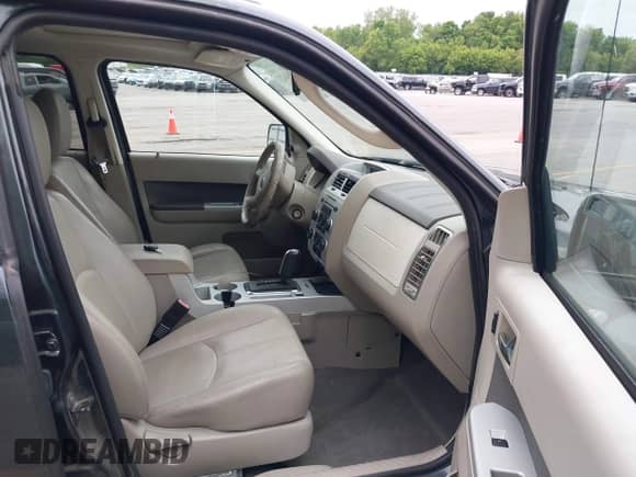 2009 Mercury Mariner Premier with VIN 4M2CU87759KJ17765, listed as a IAAI auction lot 42354423 with 163,907 mi miles and . Bid and sale history available at DreamBid. Image 5.