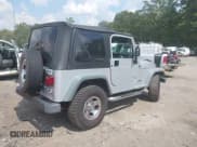 ✅ 2002 Jeep Wrangler X • VIN: 1J4FA39S02P748202 • Lot: 43266082. Wystawiony na IAAI z przebiegiem 199 437 mil. Bezpłatny archiwum sprzedaży aukcyjnych z USA i szczegółowy raport historii pojazdu na DreamBid. Zdjęcie 4.