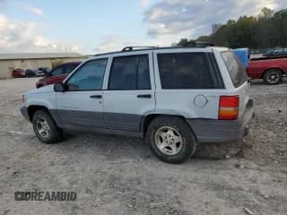 ✅ 1996 Jeep Grand Cherokee Laredo • VIN: 1J4GZ58S9TC197092 • Лот: 87362065. Опубликован ранее на Copart с пробегом 243 983 миль. Бесплатный доступ к архиву аукционных продаж из США и подробный отчёт об истории автомобиля на DreamBid. Изображение 2.