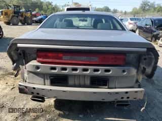 2013 Dodge Challenger SXT z VIN 2C3CDYAG0DH628853, wystawiony jako Copart lot #69860134 z przebiegiem 169 157 mil mil oraz Szkoda całkowita • Salvage title. Historia ofert i sprzedaży dostępna na DreamBid. Obrazek 6.