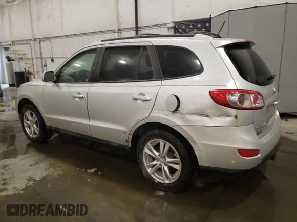 ✅ 2012 Hyundai Santa Fe SE • VIN: 5XYZHDAG7CG135865 • Lot: 85170794. Listed on Copart with 99,152 mi. Free auction sales archive from the USA and detailed vehicle history report at DreamBid. Image 2.