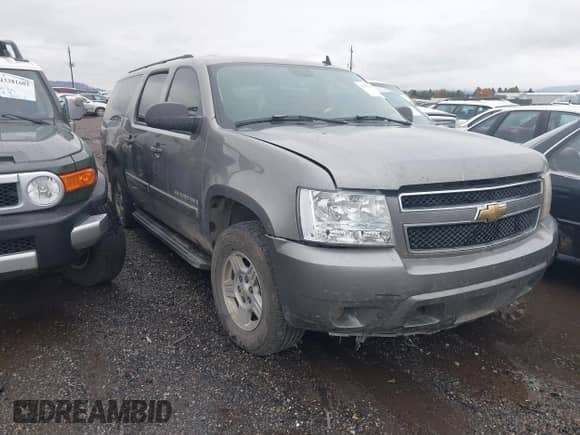 2007 Chevrolet Suburban LT z VIN 3GNFC16077G259466, wystawiony jako IAAI lot #43583193 z przebiegiem 173 941 mil mil oraz . Historia ofert i sprzedaży dostępna na DreamBid. Obrazek 1.