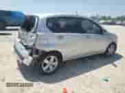 2009 Chevrolet Aveo 1LT with VIN KL1TD66E09B338773, listed as a Copart auction lot 52575765 with 102,617 mi miles and Salvage title. Bid and sale history available at DreamBid. Image 3.