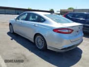 ✅ 2013 Ford Fusion Titanium Hybrid • VIN: 3FA6P0RUXDR388796 • Lot: 42840013. Listed on IAAI with Not provided. Free auction sales archive from the USA and detailed vehicle history report at DreamBid. Image 3.