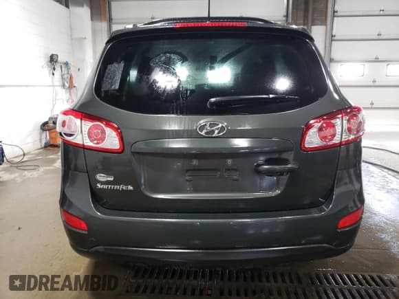 ✅ 2012 Hyundai Santa Fe SE • VIN: 5XYZH4AG3CG117525 • Lot: 75181374. Listed on Copart with 96,764 mi. Free auction sales archive from the USA and detailed vehicle history report at DreamBid. Image 6.