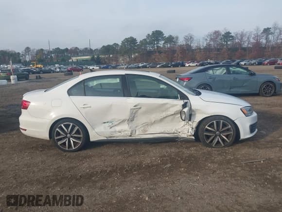 ✅ 2014 Volkswagen Jetta GLI • VIN: 3VW4T7AJ7EM385194 • Lot: 43765495. Wystawiony na IAAI z przebiegiem 151 140 mil. Bezpłatny archiwum sprzedaży aukcyjnych z USA i szczegółowy raport historii pojazdu na DreamBid. Zdjęcie 13.