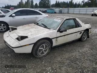 ✅ 1984 Pontiac Fiero • VIN: 1G2AF37R6EP320306 • Lot: 68255394. Wystawiony na Copart z przebiegiem 49 284 mil. Bezpłatny archiwum sprzedaży aukcyjnych z USA i szczegółowy raport historii pojazdu na DreamBid. Zdjęcie 1.