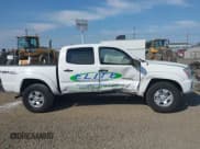 ✅ 2014 Toyota Tacoma PreRunner • VIN: 3TMJU4GN7EM158230 • Lot: 40010521. Listed on IAAI with 145,185 mi. Free auction sales archive from the USA and detailed vehicle history report at DreamBid. Image 13.