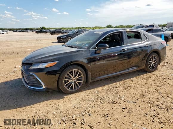 2023 Toyota Camry Hybrid XLE with VIN 4T1F31AK9PU608573, listed as a Copart auction lot 69021825 with Not provided miles and Salvage title. Bid and sale history available at DreamBid. Image 1.