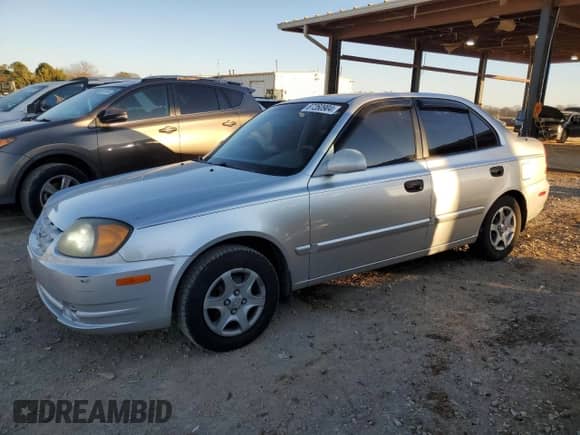 2003 Hyundai Accent GL with VIN KMHCG45C93U496038, listed as a Copart auction lot 87260904 with 104,251 mi miles and Salvage title. Bid and sale history available at DreamBid. Image 1.