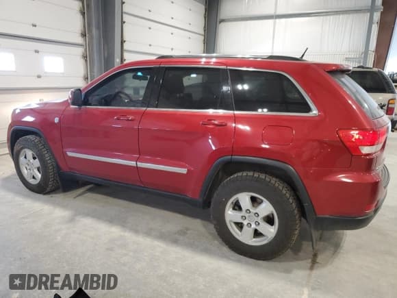 ✅ 2011 Jeep Grand Cherokee Laredo • VIN: 1J4RR4GGXBC575869 • Lot: 56389475. Listed on Copart with 131,204 mi. Free auction sales archive from the USA and detailed vehicle history report at DreamBid. Image 2.