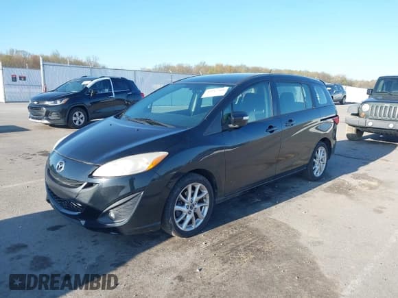 ✅ 2013 Mazda 5 Touring • VIN: JM1CW2CL9D0150904 • Lot: 42017508. Listed on IAAI with 165,192 mi. Free auction sales archive from the USA and detailed vehicle history report at DreamBid. Image 2.