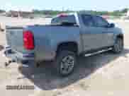 2021 Chevrolet Colorado 2WD Work Truck with VIN 1GCGSBEA4M1100950, listed as a IAAI auction lot 43116905 with 93,281 mi miles and . Bid and sale history available at DreamBid. Image 4.