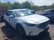 ✅ 2021 Mazda CX-9 Touring • VIN: JM3TCBCYXM0521323 • Lot: 42190976. Listed on IAAI with 56,652 mi. Free auction sales archive from the USA and detailed vehicle history report at DreamBid. Image 1.