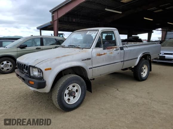 ✅ 1983 Toyota Pickup • VIN: JT4RN48S2D0070935 • Lot: 50933245. Listed on Copart with 50,699 mi. Free auction sales archive from the USA and detailed vehicle history report at DreamBid. Image 1.