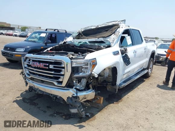 ✅ 2022 GMC Sierra 1500 SLT • VIN: 3GTU9DED5NG161022 • Лот: 42746760. Опубликован ранее на IAAI с пробегом 77 157 миль. Бесплатный доступ к архиву аукционных продаж из США и подробный отчёт об истории автомобиля на DreamBid. Изображение 2.