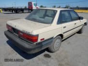 ✅ 1987 Toyota Camry • VIN: JT2SV21EXH3130273 • Lot: 42472806. Wystawiony na IAAI z przebiegiem 124 958 mil. Bezpłatny archiwum sprzedaży aukcyjnych z USA i szczegółowy raport historii pojazdu na DreamBid. Zdjęcie 4.