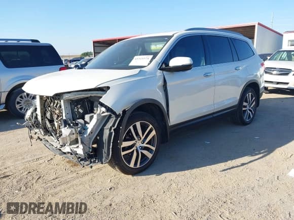 ✅ 2018 Honda Pilot Touring • VIN: 5FNYF6H98JB019227 • Lot: 43315574. Listed on IAAI with 115,889 mi. Free auction sales archive from the USA and detailed vehicle history report at DreamBid. Image 2.