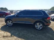 ✅ 2014 Volkswagen Touareg Exec • VIN: WVGEP9BP6ED010186 • Lot: 43203802. Wystawiony na IAAI z przebiegiem Nie podano. Bezpłatny archiwum sprzedaży aukcyjnych z USA i szczegółowy raport historii pojazdu na DreamBid. Zdjęcie 14.